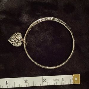 Silver tone bracelet with Helen Keller quote